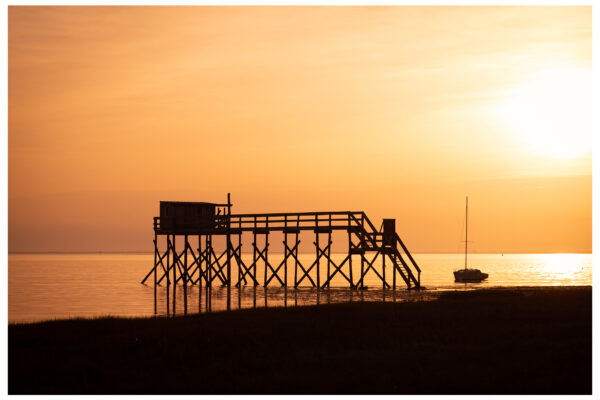 Sunset silhouette picture of fishing platform in Fouras, France